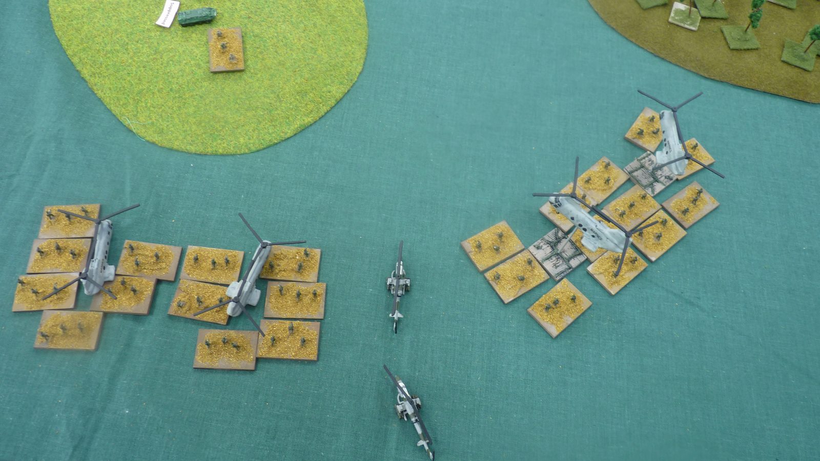 Helicopters land and deposit their infantry